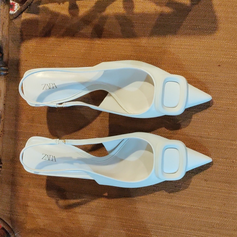 Woman's new beige kitten heels.